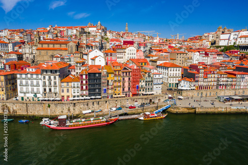 Porto Cityscape with Dom Luis I Bridge over Douro River and medieval Ribeira district at day time, Portugal