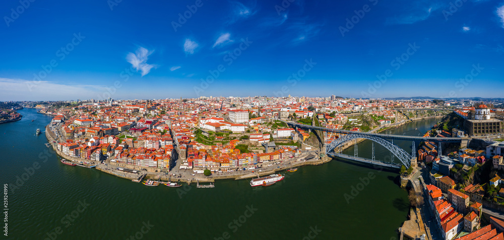 Fototapeta premium Porto Cityscape with Dom Luis I Bridge over Douro River and medieval Ribeira district at day time, Portugal