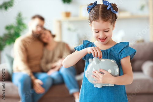 family savings, budget planning, children's pocket money. family with piggy Bank