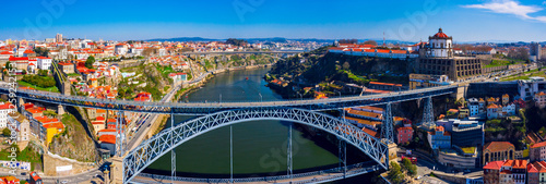 Porto Cityscape with Dom Luis I Bridge over Douro River and medieval Ribeira district at day time, Portugal