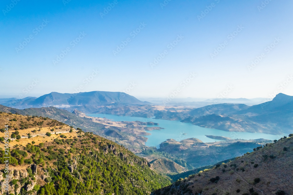 The lake of Zahara de la Sierra between the mountains, landscape of Andalusia, Spain