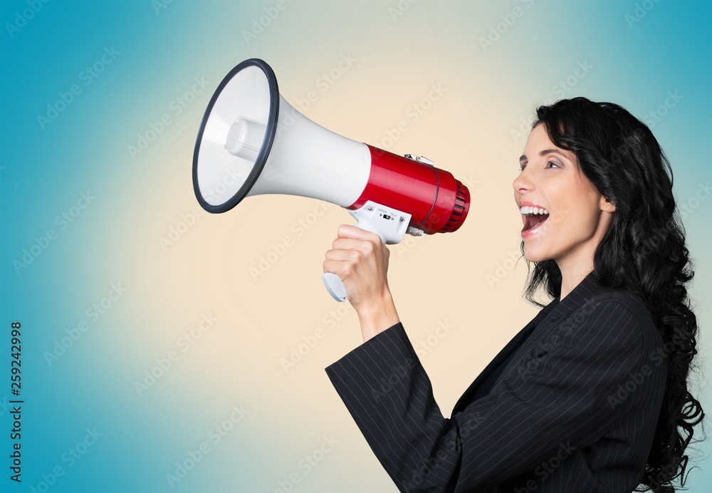 Portrait of woman holding megaphone, dressed in pin-up style Portrait of woman holding megaphone, dressed in pin-up style