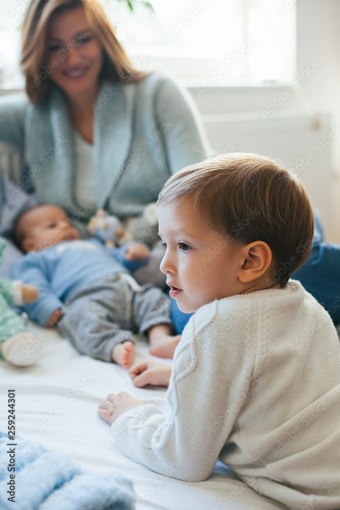 Mother and her children spending time indoor Mother and her children spending time indoor