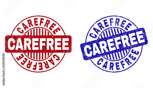 Grunge CAREFREE round stamp seals isolated on a white background. Round seals with grunge texture in red and blue colors. Vector rubber imitation of CAREFREE text inside circle form with stripes.