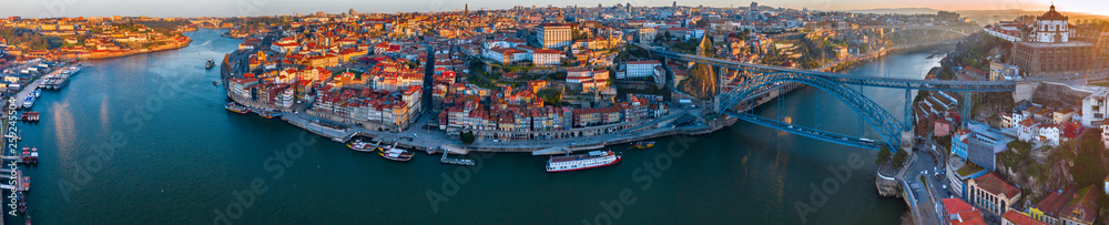 Porto Cityscape with Dom Luis I Bridge over Douro River and medieval Ribeira district at sunset, Portugal