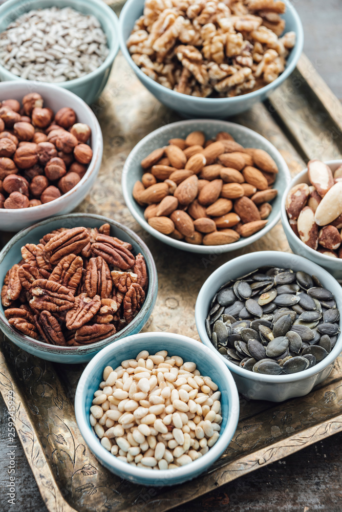Food: Variation of nuts in bowls Food: Variation of nuts in bowls