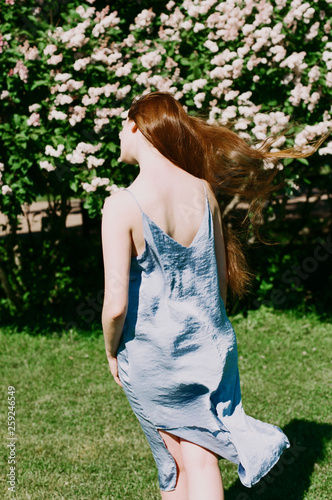 Atmospheric portrait among spring blossom. photo