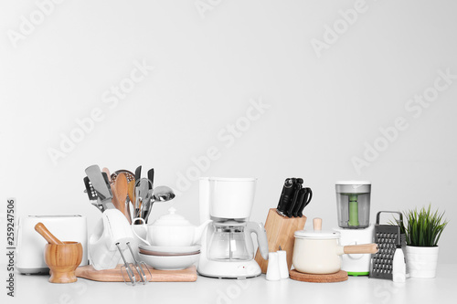 Set of clean cookware, dishes, utensils and appliances isolated on white