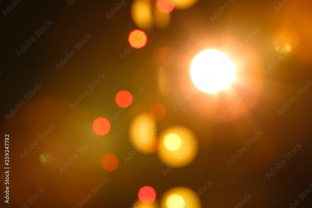 Blurred view of beautiful lights on dark background. Bokeh effect Blurred view of beautiful lights on dark background. Bokeh effect