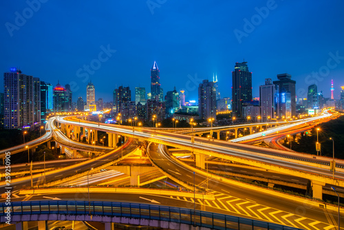 Shanghai elevated road junction and interchange overpass at night in China.
