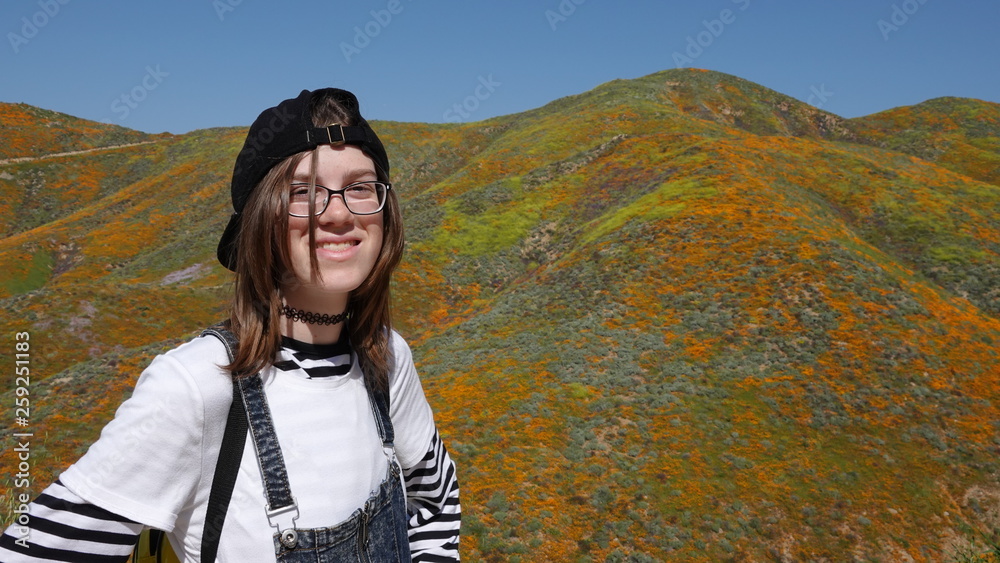 Modern teen girl smiles for casual outdoor portrait
