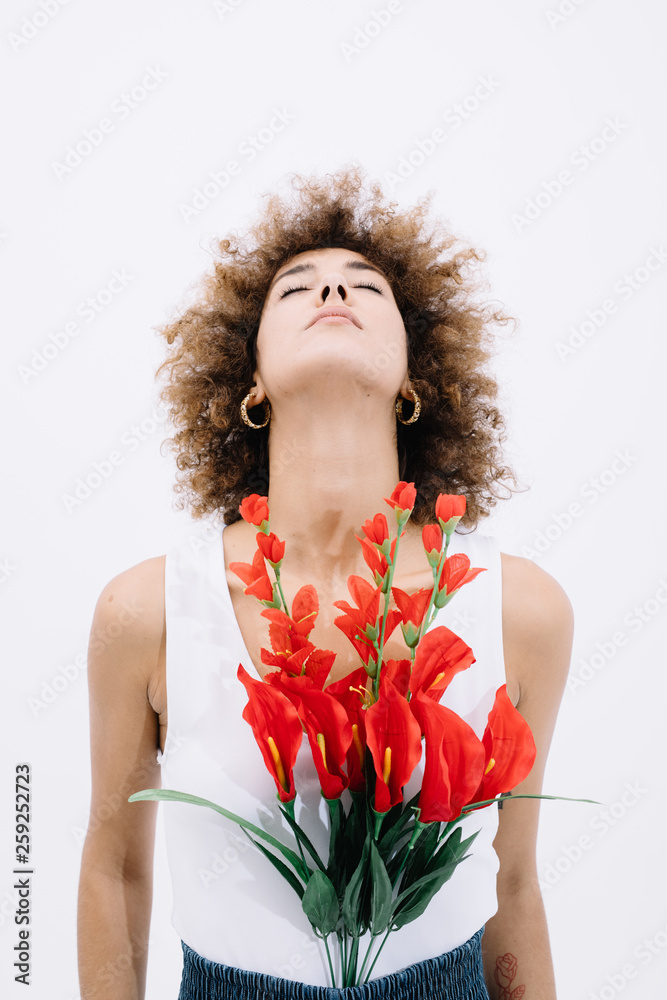 Sensual woman with bouquet of flowers Sensual woman with bouquet of flowers