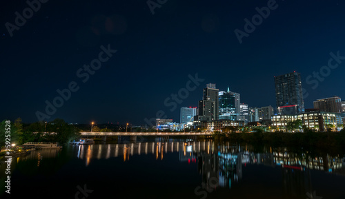 View of the Lamar Ave Bridge With Downtown Austin in the Background at Night