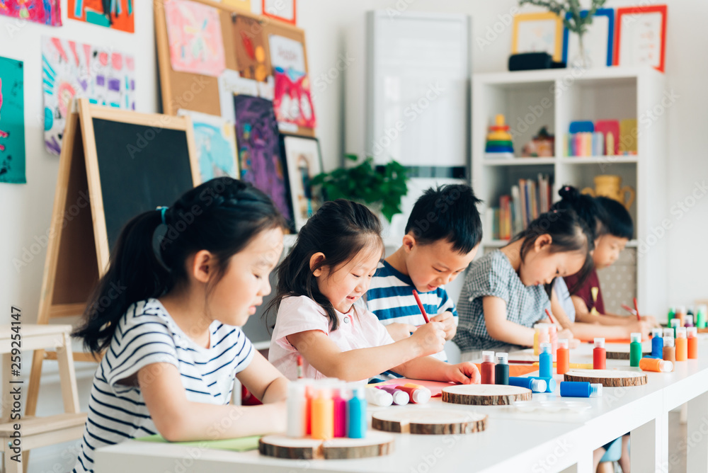Preschool kids painting in classroom Preschool kids painting in classroom