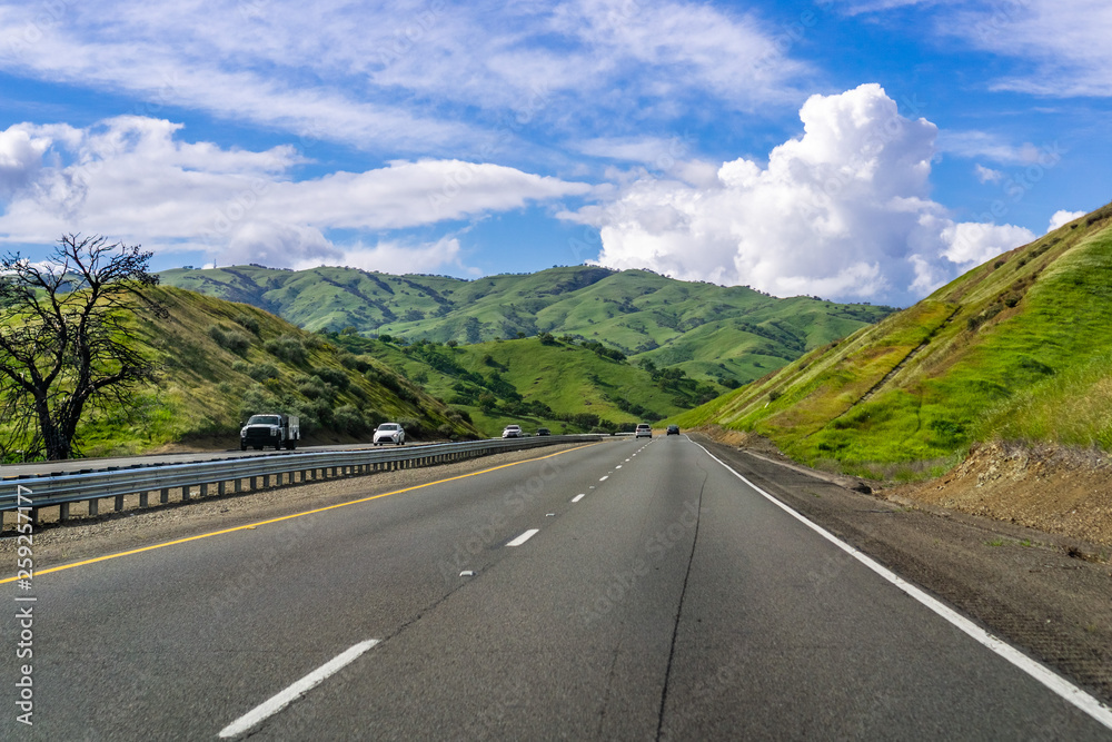 Travelling through bright green hills in south San Francisco bay area, California
