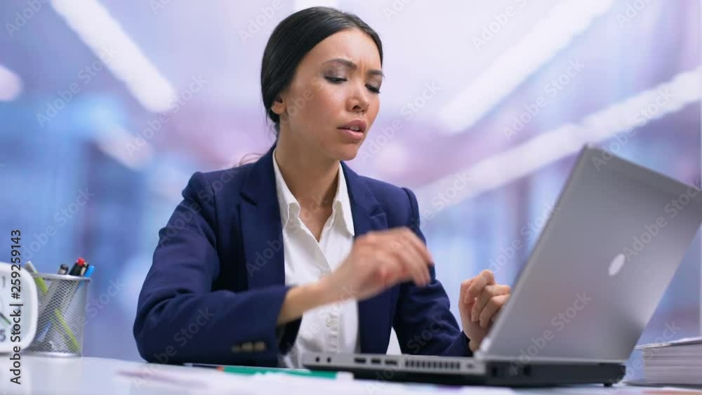 Tired business woman suffering from neck pain sitting front laptop, health care Tired business woman suffering from neck pain sitting front laptop, health care