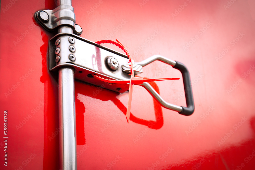 Steel door a truck lock with protective lead seal. Cargo Container Door Locked Protect Safety