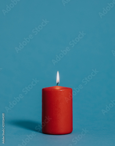 Red lit candle photo