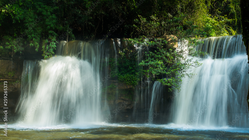 Beautiful waterfall in natural 'Si Dit Waterfall' with blue sky in khao kho national park 