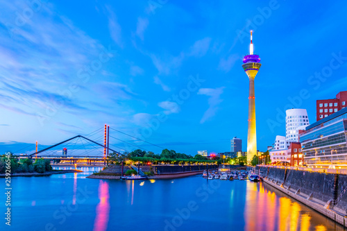 фотографія Sunset view of the Rheinturm in Dusseldorf, Germany