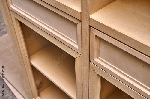 Production of wood furniture. Wardrobe with drawers. Furniture manufacture. Close-up