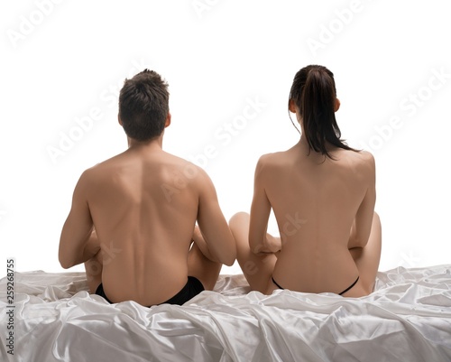 Young loving couple isolated rearview in bed