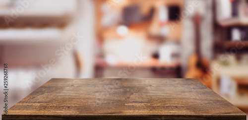 Perspective wood table counter in home office.Empty wooden tabletop with blurred music workplace background.Mock up template for display or montage of your design,Banner for advertise of product
