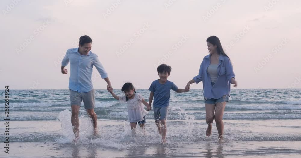 SLOW MOTION, Asian family running with happy emotion at Beach together. Family, Holiday and Travel concept. SLOW MOTION, Asian family running with happy emotion at Beach together. Family, Holiday and Travel concept.