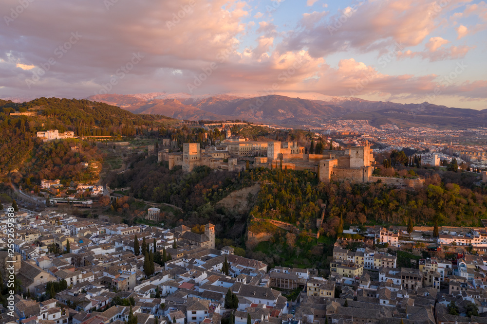 Granada Alhambra medieval palace castle at sunset aerial view