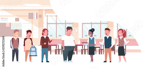 mix race pupils mocking for fat obese school boy obesity concept friends bullying sad overweight guy in classroom horizontal full length flat