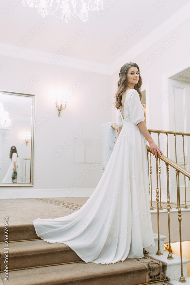 Light wedding photo shoot in European style. The bride before the ceremony at the registry office. Light wedding photo shoot in European style. The bride before the ceremony at the registry office.
