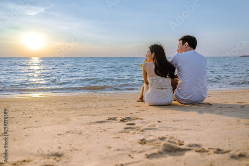 Asian couple are happy with love on the beach at summer weekend holiday. © jumlongch