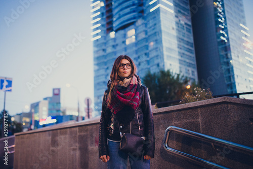 portrait of a beautiful girl with glasses outdoor evening