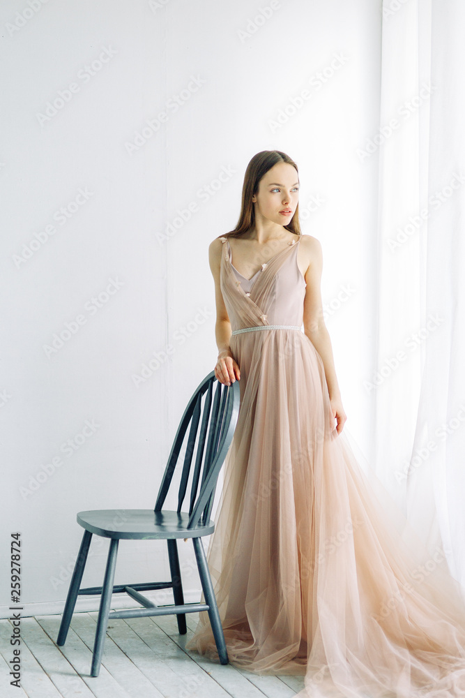 Bride in the interior Studio and minimalism. A classic European-style wedding. Bride in the interior Studio and minimalism. A classic European-style wedding.