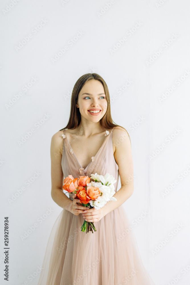 Wedding decor and minimalism. A bright modern bouquet on a white background. Wedding decor and minimalism. A bright modern bouquet on a white background.