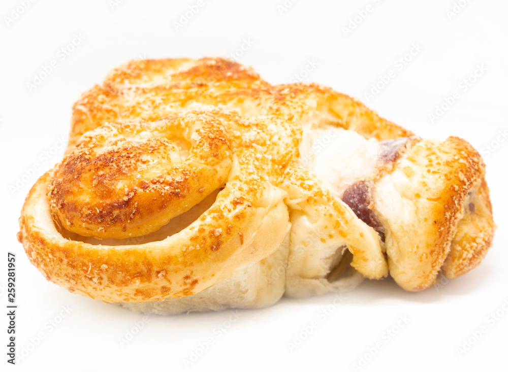 Buttered bread, sugar and stuffed with sausage on a white background Buttered bread, sugar and stuffed with sausage on a white background