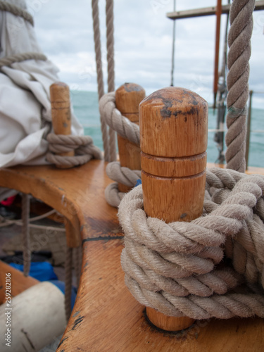 Ropes of an ancient whaler in the foreground and in the background the island where the puffins live. photo