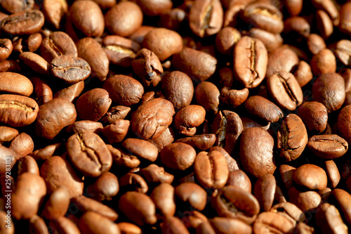 Fried coffee beans close-up - excellent morning breakfast. Black Espresso.