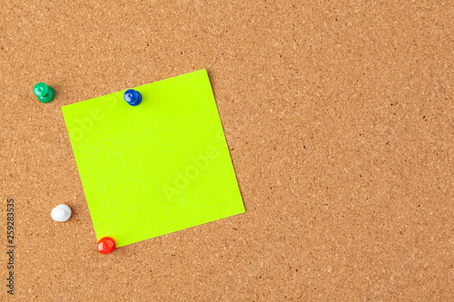 note paper pined on brown cork board background