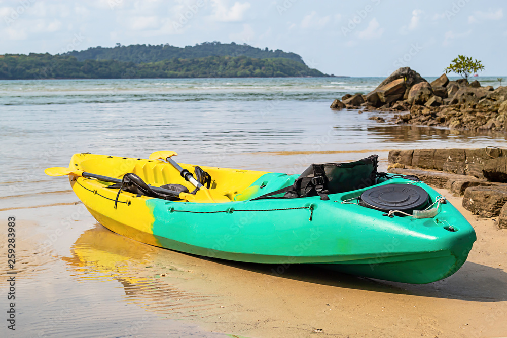 Kayaking on the sand of the sea background mountains and rocks. Kayaking on the sand of the sea background mountains and rocks.