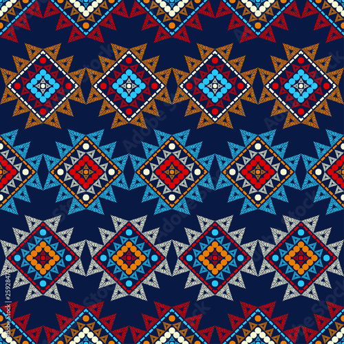Ethnic boho seamless pattern. Embroidery on fabric. Patchwork texture. Weaving. Traditional ornament. Tribal pattern. Folk motif. Can be used for wallpaper, textile, invitation card, wrapping, web pag