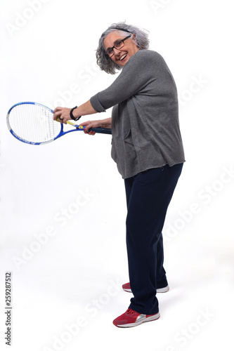 woman playing tennis on white background © curto