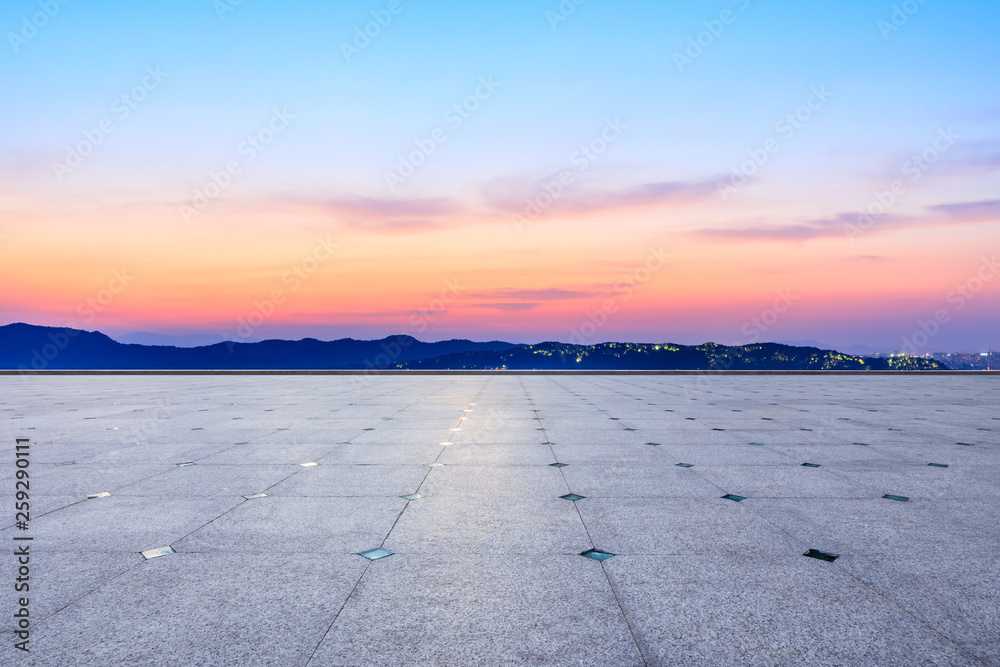 Fototapeta premium Empty square floor and beautiful mountain nature landscape at sunset
