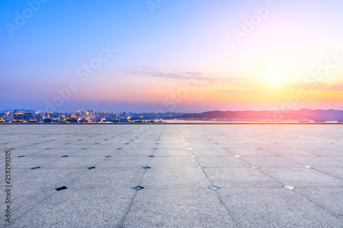 Empty square floor and beautiful city scenery with mountain in Hangzhou