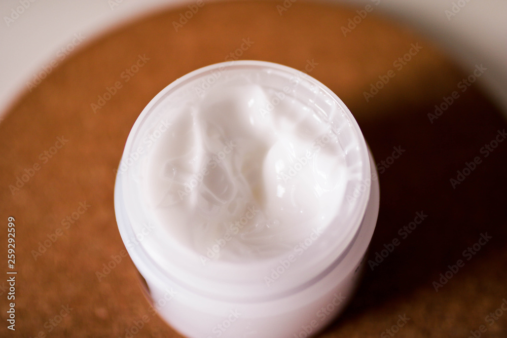 Open jar with body cream close up view. Textured body cream. Open jar with body cream close up view. Textured body cream.