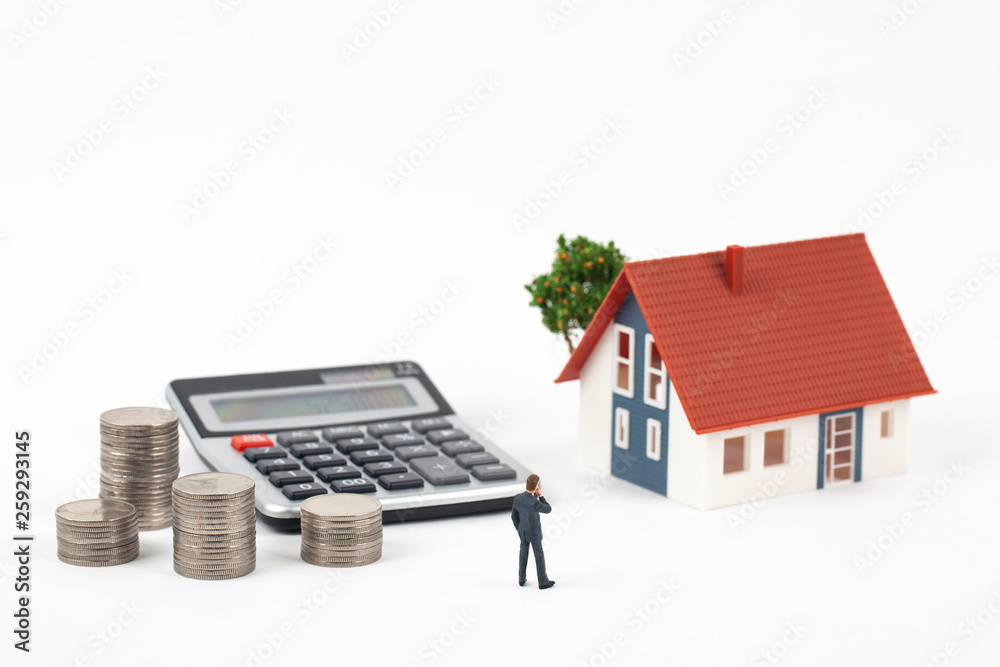 miniature businessman and coins with model house miniature businessman and coins with model house