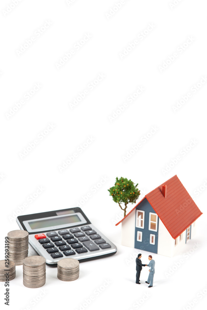 two miniature businessmen and coins with model house two miniature businessmen and coins with model house