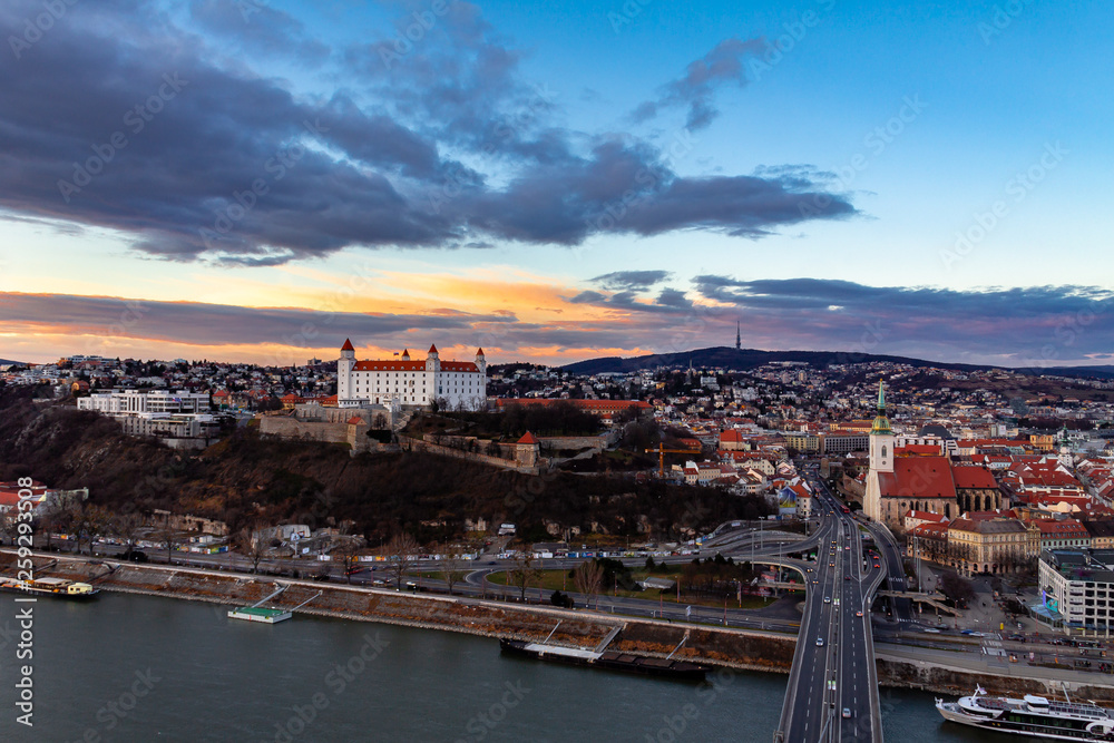 Bratislava, Slovakia: aerial panorama of the old city center at sunset across the Danube river