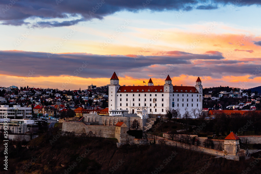 Bratislava, Slovakia: aerial view of Bratislava castle standing above the old town at sunset