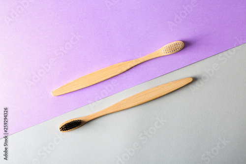 Toothbrushes on color background